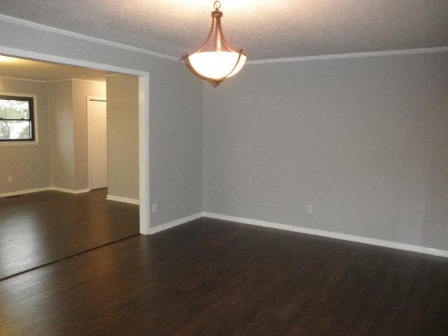 11 Hilltop Road Fayetteville, TN 37334 - Photo 2 of 24 Living room opens to the dining room and kitchen. Home is freshly painted with new flooring throughout.
