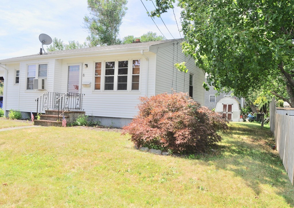 8 Rochambeau Street Fairhaven, MA 02719 - Photo 3 of 10 a front view of a house with a yard and garage