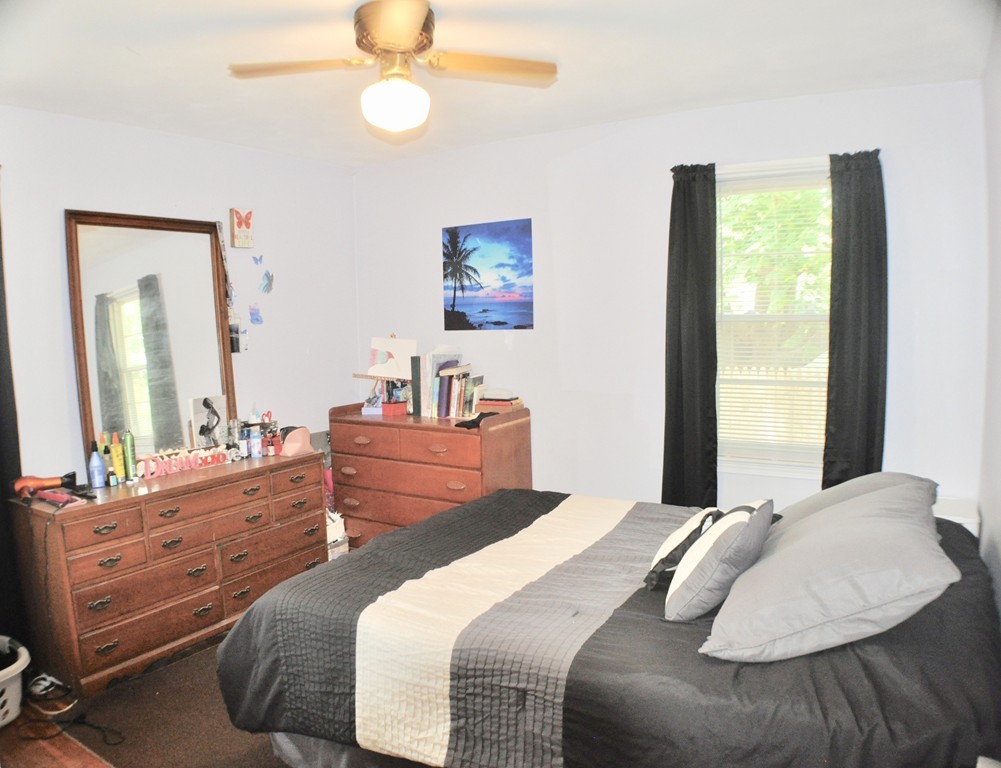 8 Rochambeau Street Fairhaven, MA 02719 - Photo 7 of 10 a bedroom with a bed and a dresser