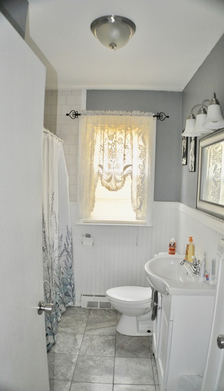 8 Rochambeau Street Fairhaven, MA 02719 - Photo 8 of 10 a bathroom with a sink toilet and shower