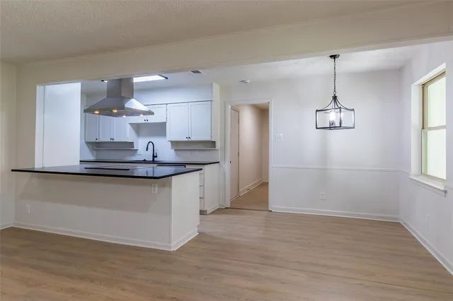 a kitchen with kitchen island a counter top space and appliances