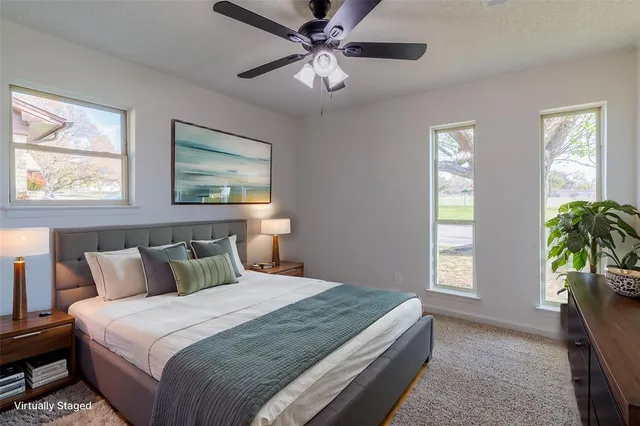 a bedroom with bed and window