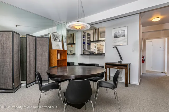 a dining room with furniture and window