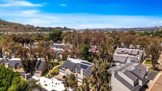 an aerial view of residential house and green space
