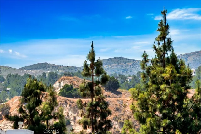 an aerial view of residential building with green space
