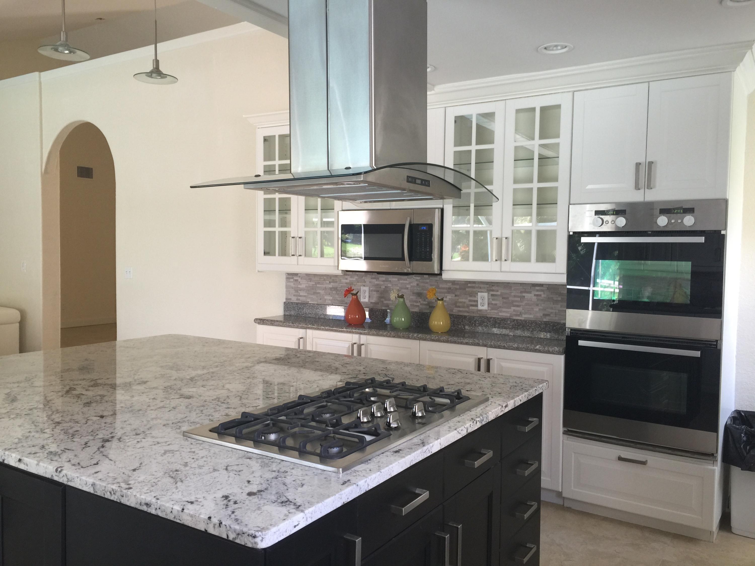 285 Northwest 69th Street Boca Raton, FL 33487 - Photo 6 of 30 Gas range and granite top