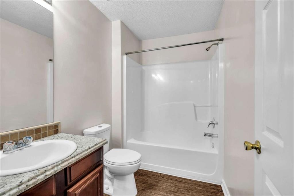 6724 Overlook Ridge College Park, GA 30349 - Photo 16 of 34 a bathroom with a granite countertop sink toilet and shower