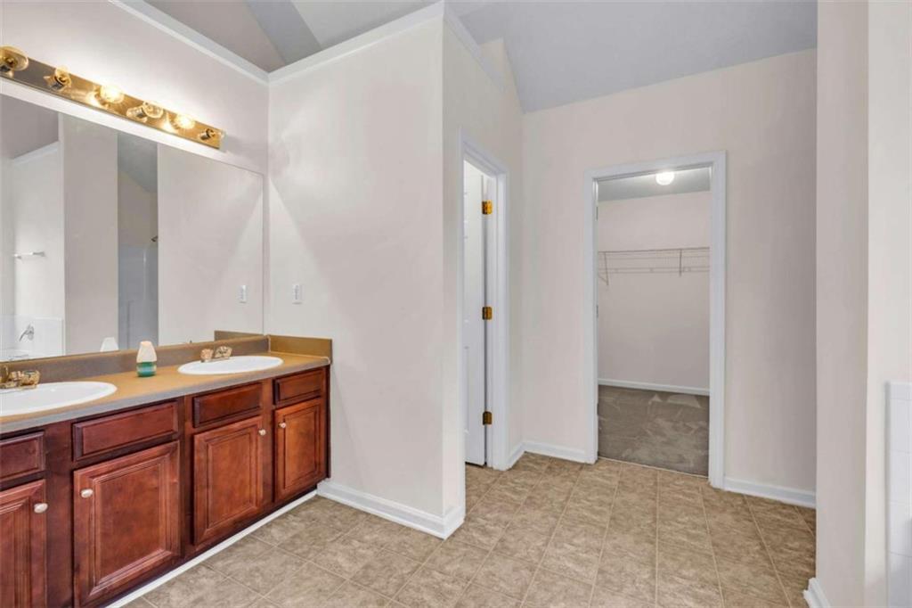 6724 Overlook Ridge College Park, GA 30349 - Photo 28 of 34 a bathroom with a double vanity sink and mirror