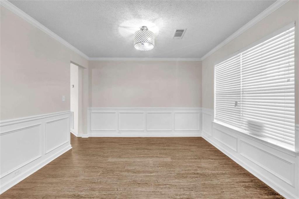 6724 Overlook Ridge College Park, GA 30349 - Photo 5 of 34 a view of an empty room with a window and wooden floor
