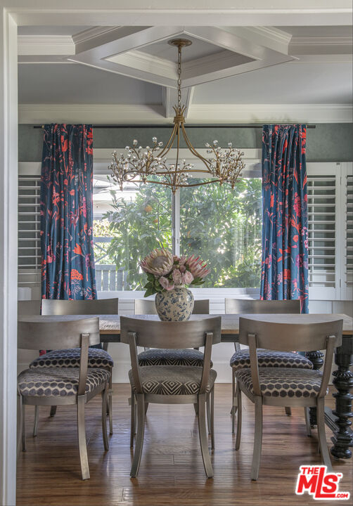 55 West Altadena Drive Altadena, CA 91001 - Photo 13 of 42 a kitchen with stainless steel appliances granite countertop a table and chairs in it