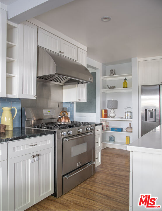 55 West Altadena Drive Altadena, CA 91001 - Photo 14 of 42 a kitchen with stainless steel appliances granite countertop a stove and cabinets