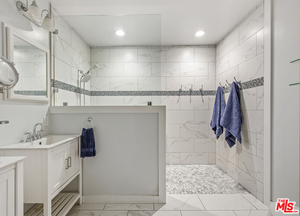 55 West Altadena Drive Altadena, CA 91001 - Photo 24 of 42 a bathroom with a sink a toilet and shower