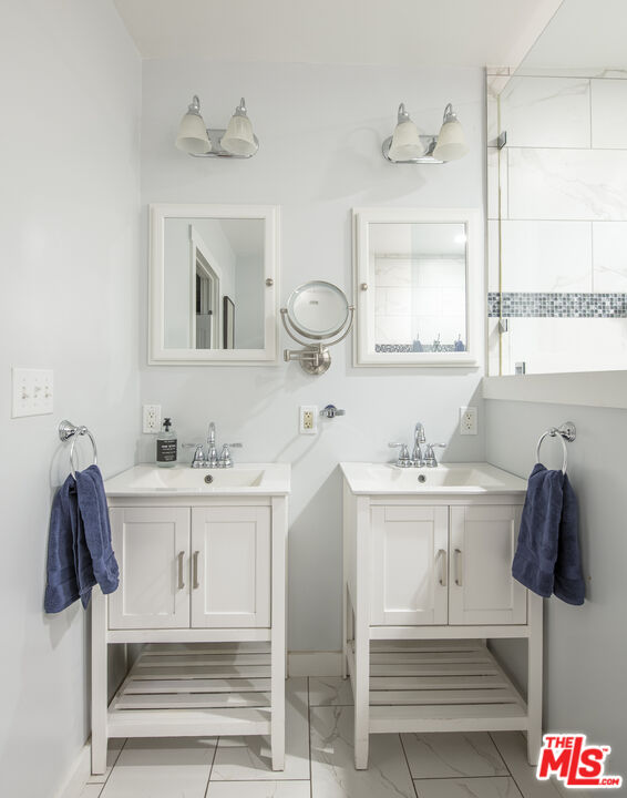 55 West Altadena Drive Altadena, CA 91001 - Photo 26 of 42 a bathroom with a sink vanity and mirror