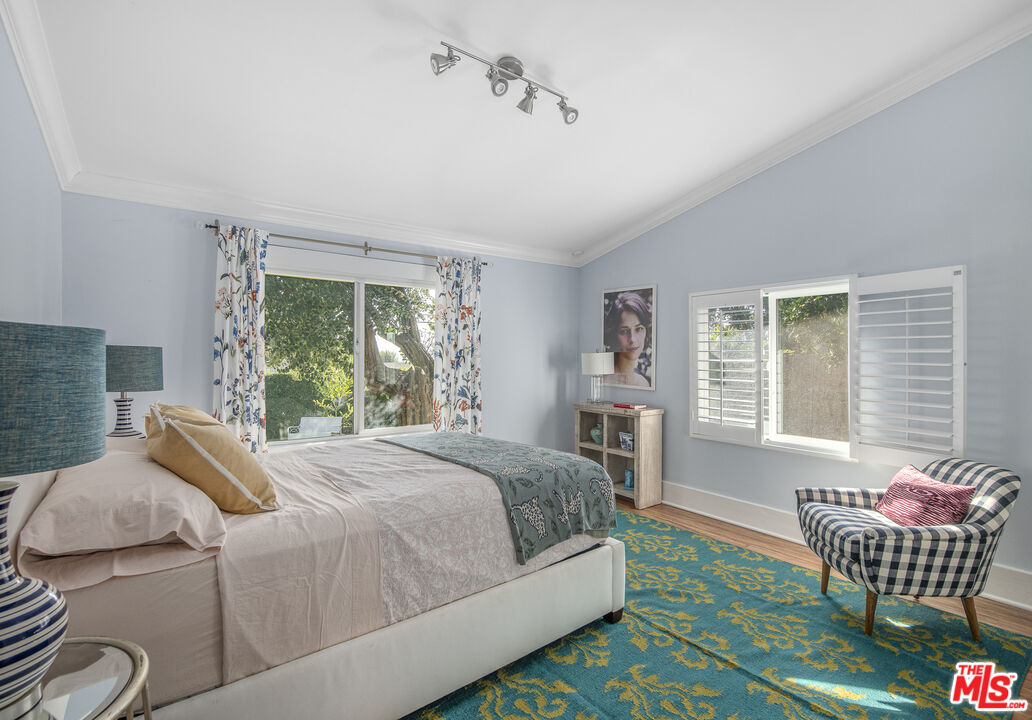 55 West Altadena Drive Altadena, CA 91001 - Photo 29 of 42 a bed room with a bed and a chair