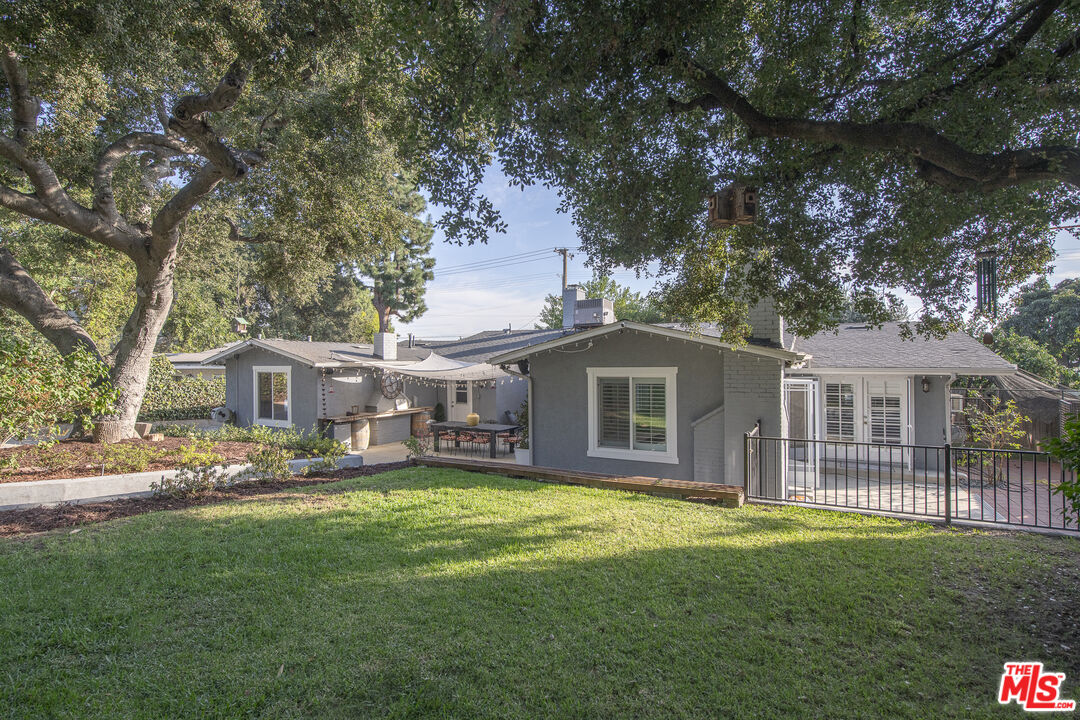 55 West Altadena Drive Altadena, CA 91001 - Photo 36 of 42 a front view of a house with a garden