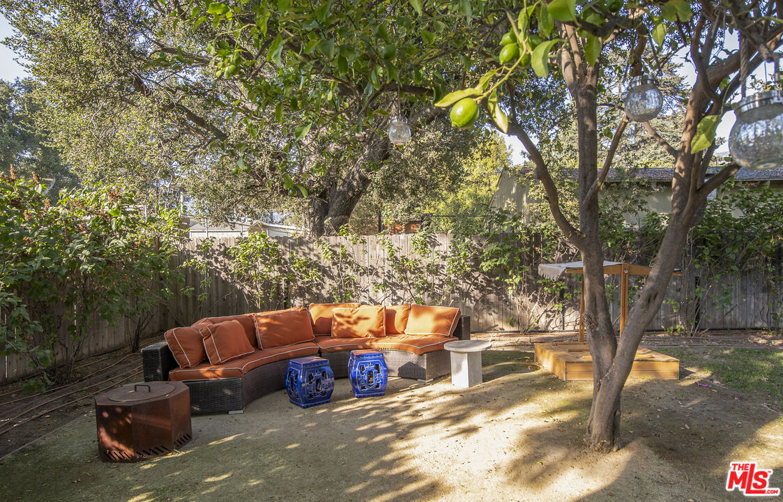 55 West Altadena Drive Altadena, CA 91001 - Photo 39 of 42 a backyard of a house with table and chairs