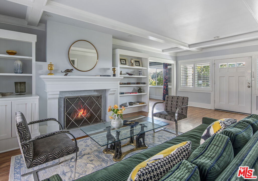 55 West Altadena Drive Altadena, CA 91001 - Photo 9 of 42 a living room with furniture a rug a fireplace and a window
