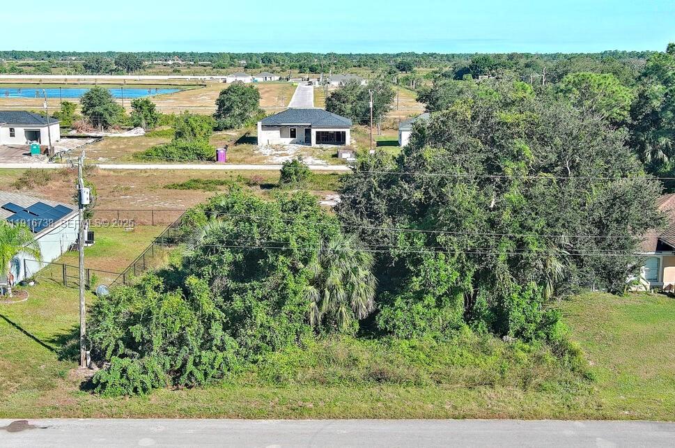 a aerial view of a house with a lake view