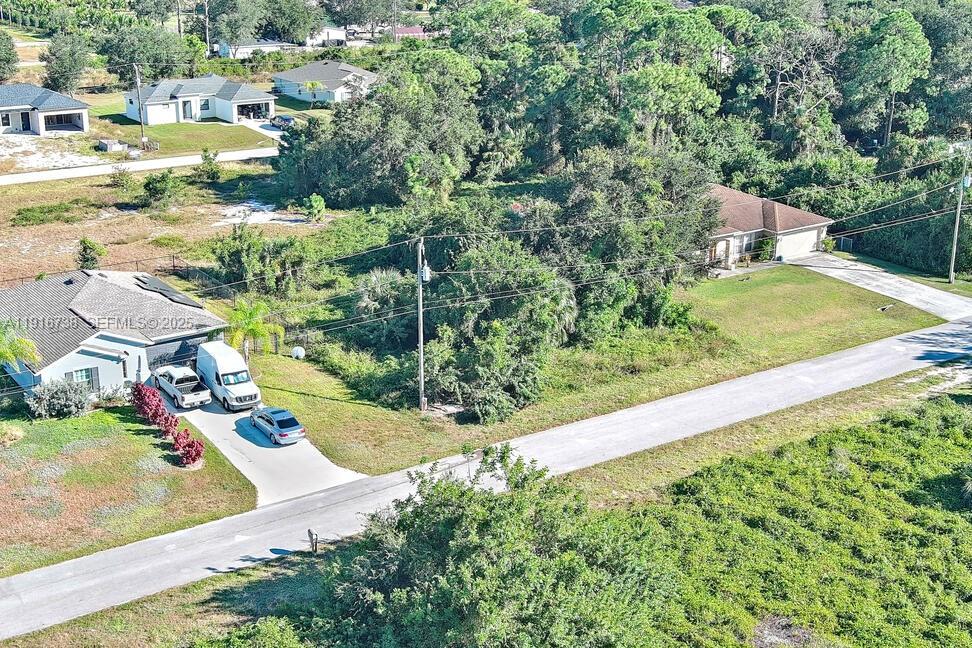341 Ranchito Avenue Lehigh Acres, FL 33974 - Photo 11 of 22 a view of a yard with an outdoor seating