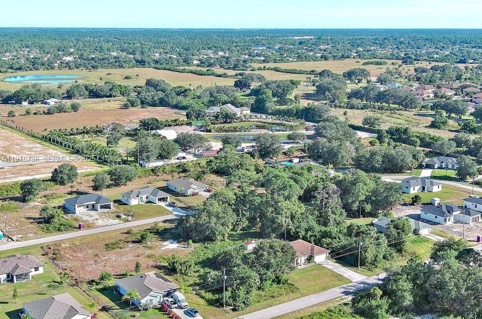 341 Ranchito Avenue Lehigh Acres, FL 33974 - Photo 12 of 22 an aerial view of a city