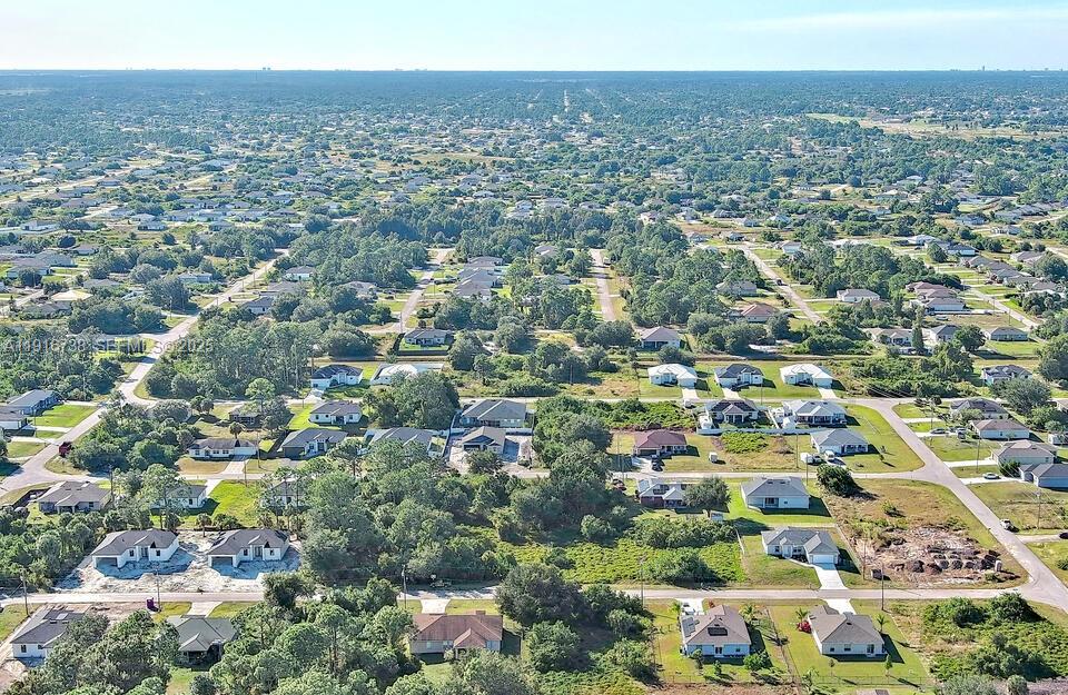 341 Ranchito Avenue Lehigh Acres, FL 33974 - Photo 19 of 22 an aerial view of multiple house