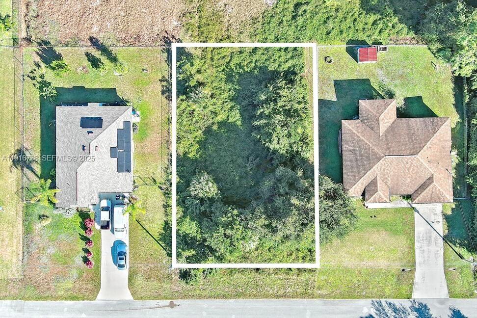 341 Ranchito Avenue Lehigh Acres, FL 33974 - Photo 2 of 22 a bird view of garden