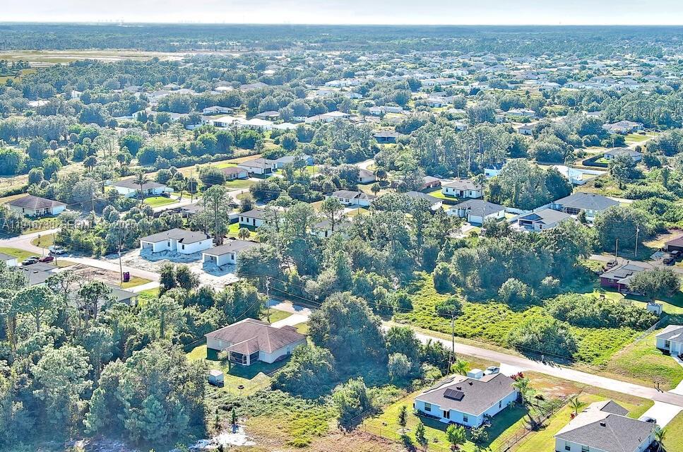 341 Ranchito Avenue Lehigh Acres, FL 33974 - Photo 21 of 22 an aerial view of multiple house