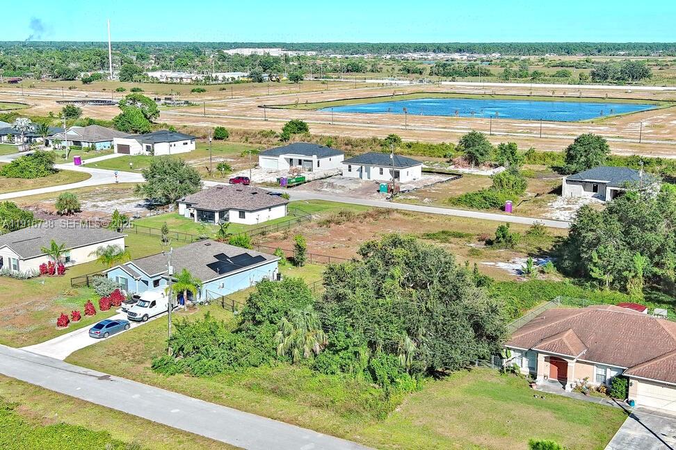 341 Ranchito Avenue Lehigh Acres, FL 33974 - Photo 6 of 22 a view of lake view and mountain view in back
