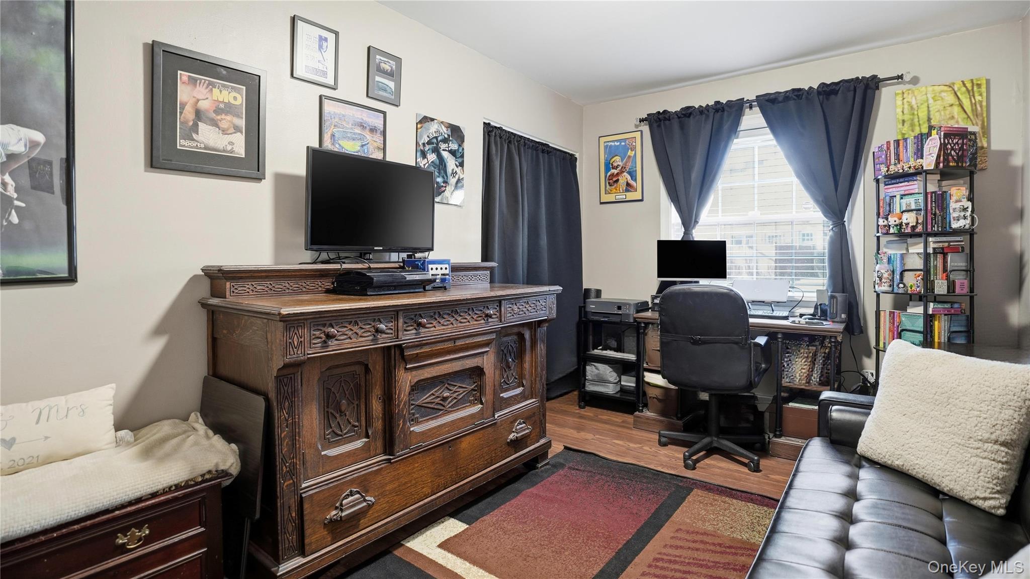 460 Old Town Road, Unit 28A East Setauket, NY 11766 - Photo 13 of 28 a view of a workspace with furniture and a window