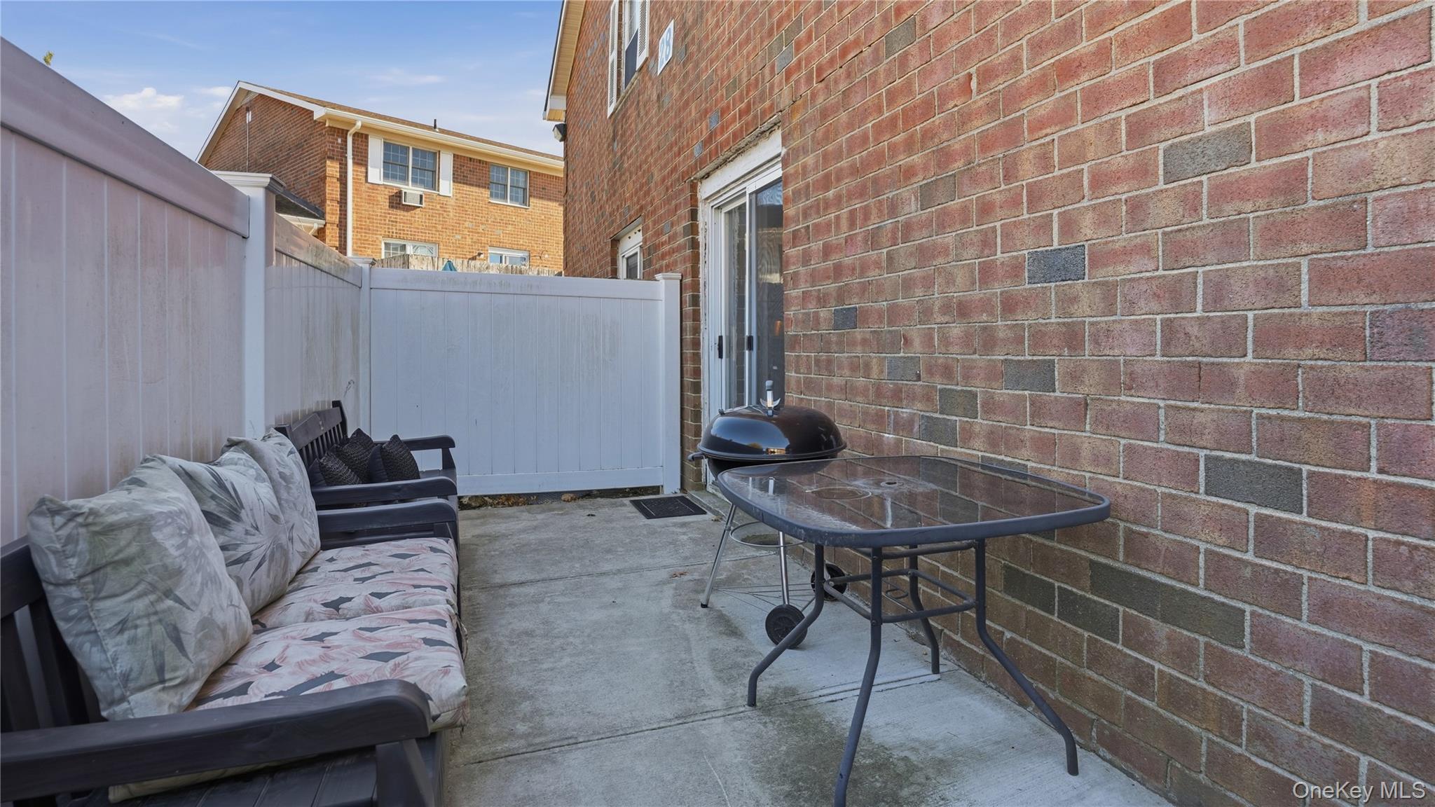 460 Old Town Road, Unit 28A East Setauket, NY 11766 - Photo 14 of 28 a view of a chairs and a table in the patio