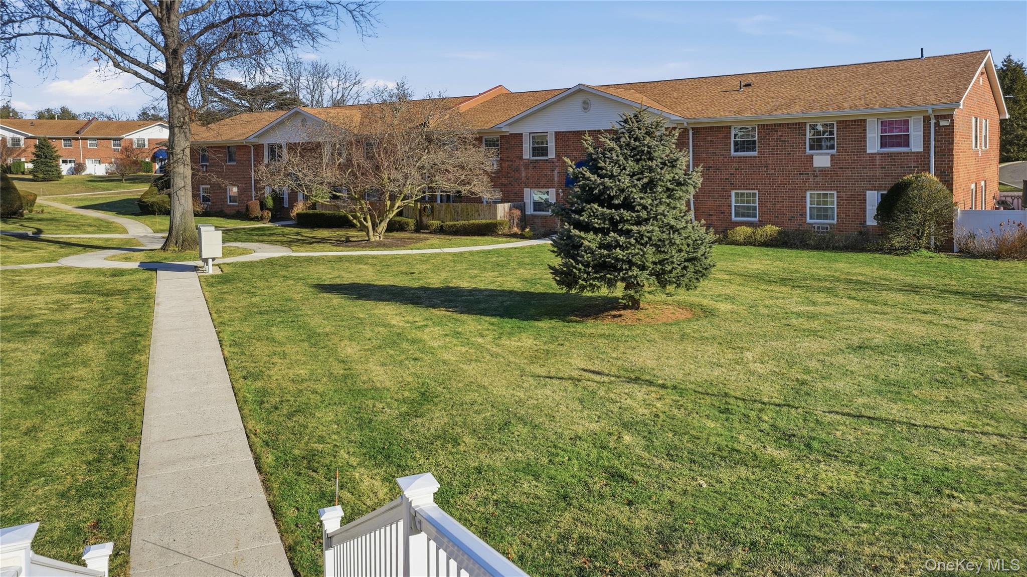 460 Old Town Road, Unit 28A East Setauket, NY 11766 - Photo 19 of 28 a view of a house with a yard