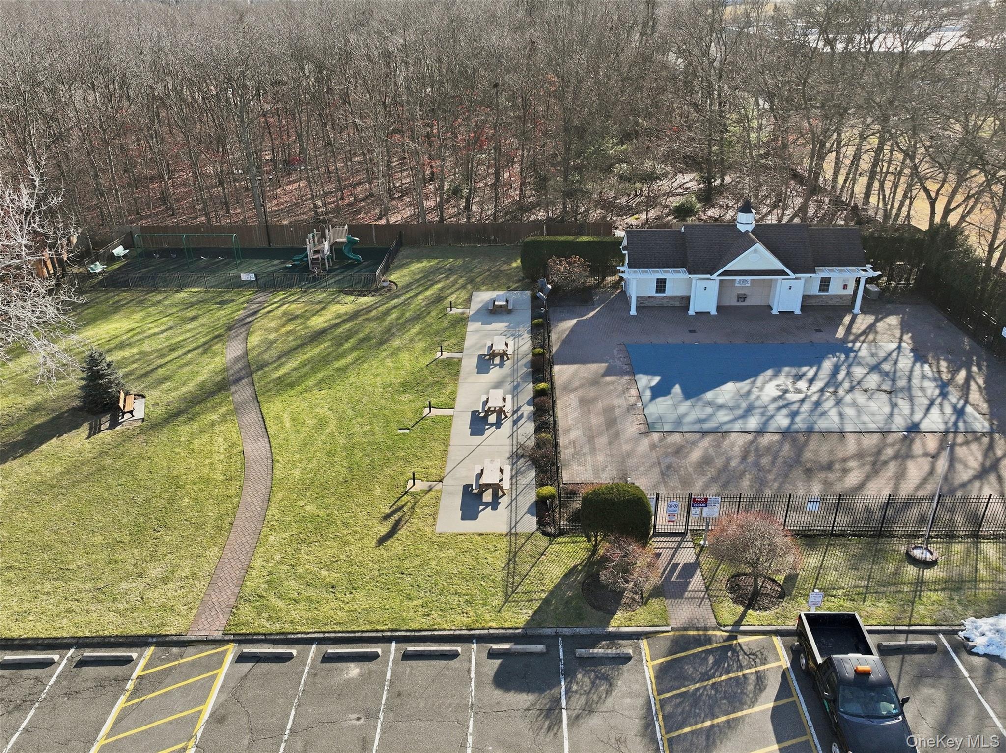 460 Old Town Road, Unit 28A East Setauket, NY 11766 - Photo 20 of 28 a view of swimming pool with sitting area