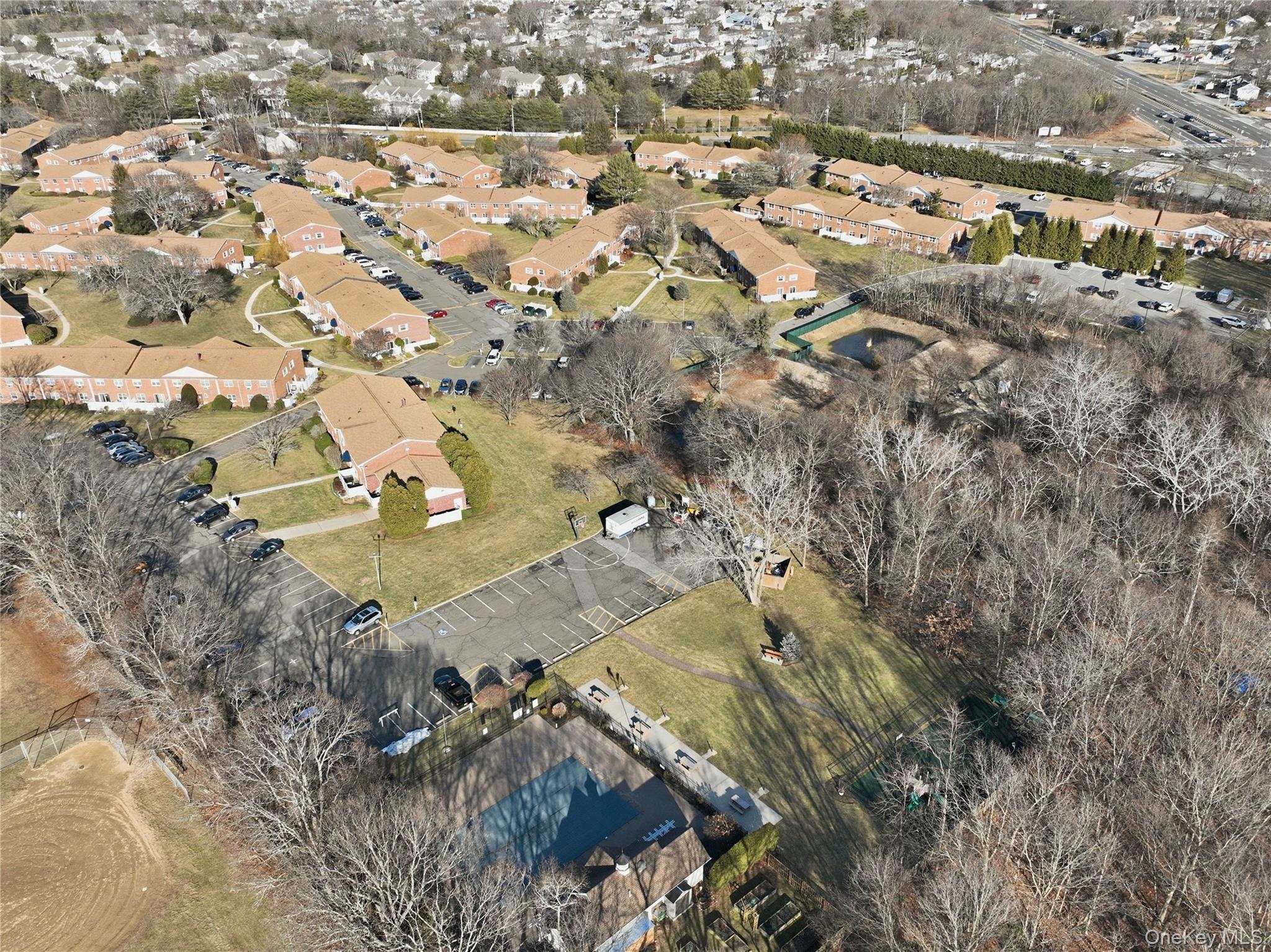 460 Old Town Road, Unit 28A East Setauket, NY 11766 - Photo 28 of 28 an aerial view of residential houses with outdoor space