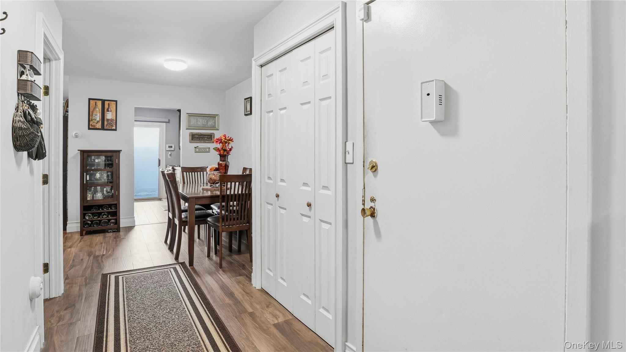 460 Old Town Road, Unit 28A East Setauket, NY 11766 - Photo 4 of 28 a dining room with furniture and a table