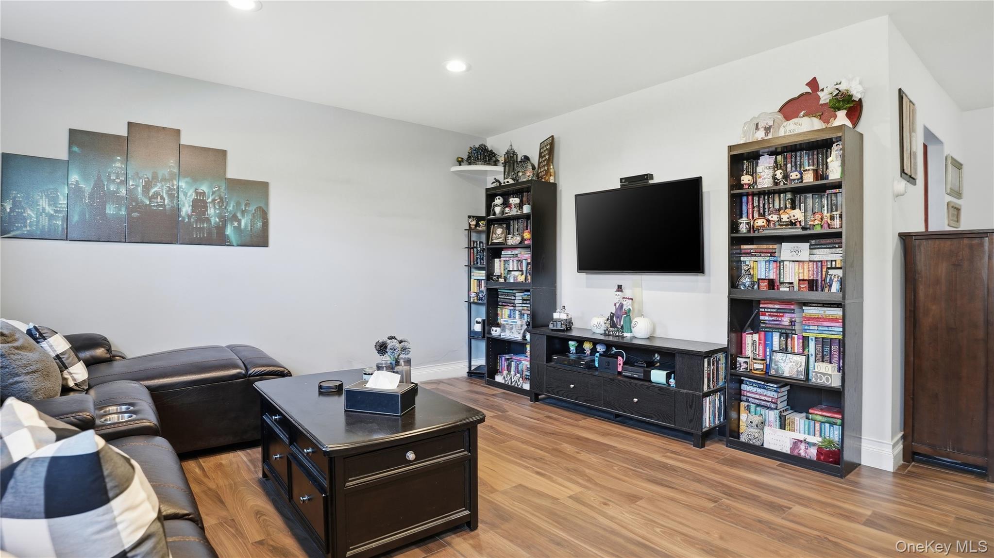 460 Old Town Road, Unit 28A East Setauket, NY 11766 - Photo 10 of 28 a living room with furniture and a flat screen tv