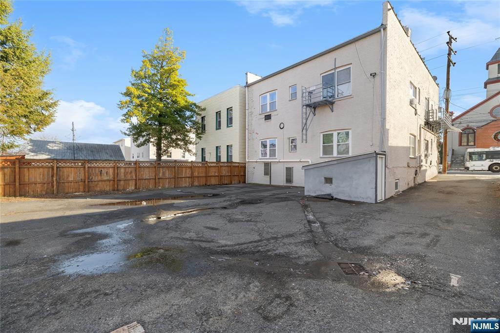 467 Hudson Street Hackensack, NJ 07601 - Photo 3 of 13 a view of a house with backyard and trees