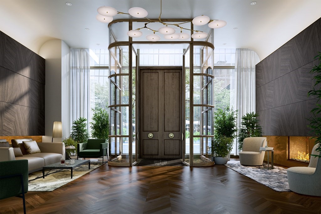 40 Trinity Place, Unit 33G Boston, MA 02116 - Photo 3 of 15 a living room with furniture and wooden floor