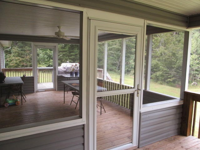 1557 Hillendale Road Crossville, TN 38572 - Photo 16 of 20 a view of a room with wooden floor and a floor to ceiling window