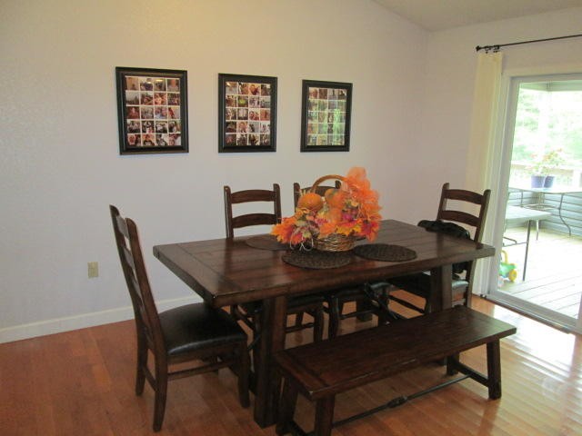 1557 Hillendale Road Crossville, TN 38572 - Photo 5 of 20 a view of a dining room with furniture and wooden floor