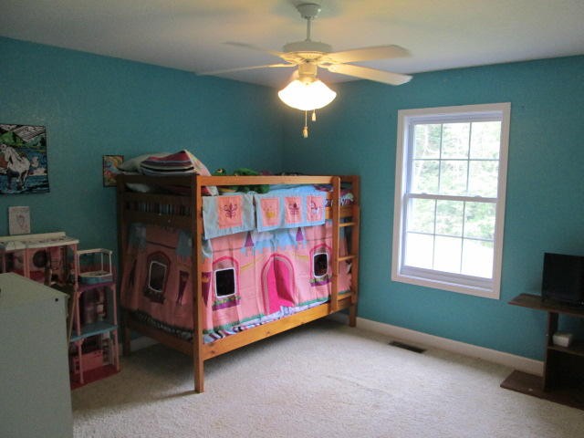 1557 Hillendale Road Crossville, TN 38572 - Photo 8 of 20 a bedroom with a bed and a chandelier