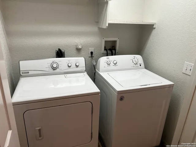 a utility room with dryer and washer