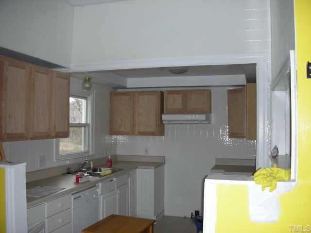 2319 Garner Road Raleigh, NC 27610 - Photo 2 of 6 a kitchen with a sink and cabinets