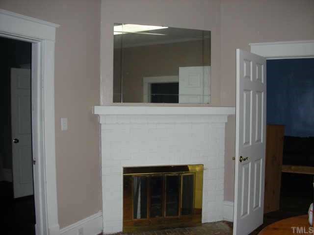 2319 Garner Road Raleigh, NC 27610 - Photo 3 of 6 a view of a livingroom with a fireplace
