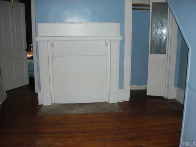 2319 Garner Road Raleigh, NC 27610 - Photo 5 of 6 an empty room with wooden floor