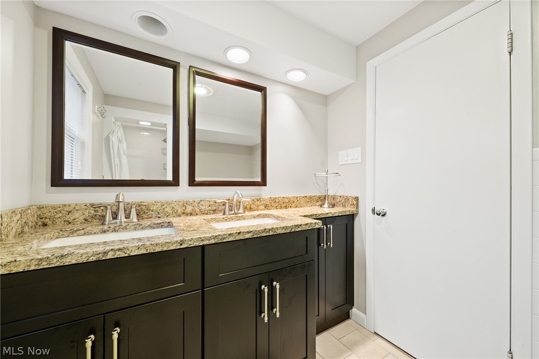 4536 Mackall Road South Euclid, OH 44121 - Photo 19 of 23 The upstairs Bathroom is newly remodeled with granite countertops.