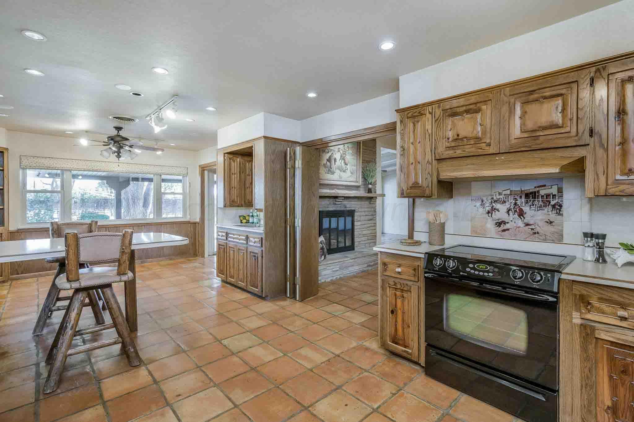 7517 Duling Lane Amarillo, TX 79110 - Photo 14 of 80 a kitchen with stainless steel appliances granite countertop a stove and a refrigerator