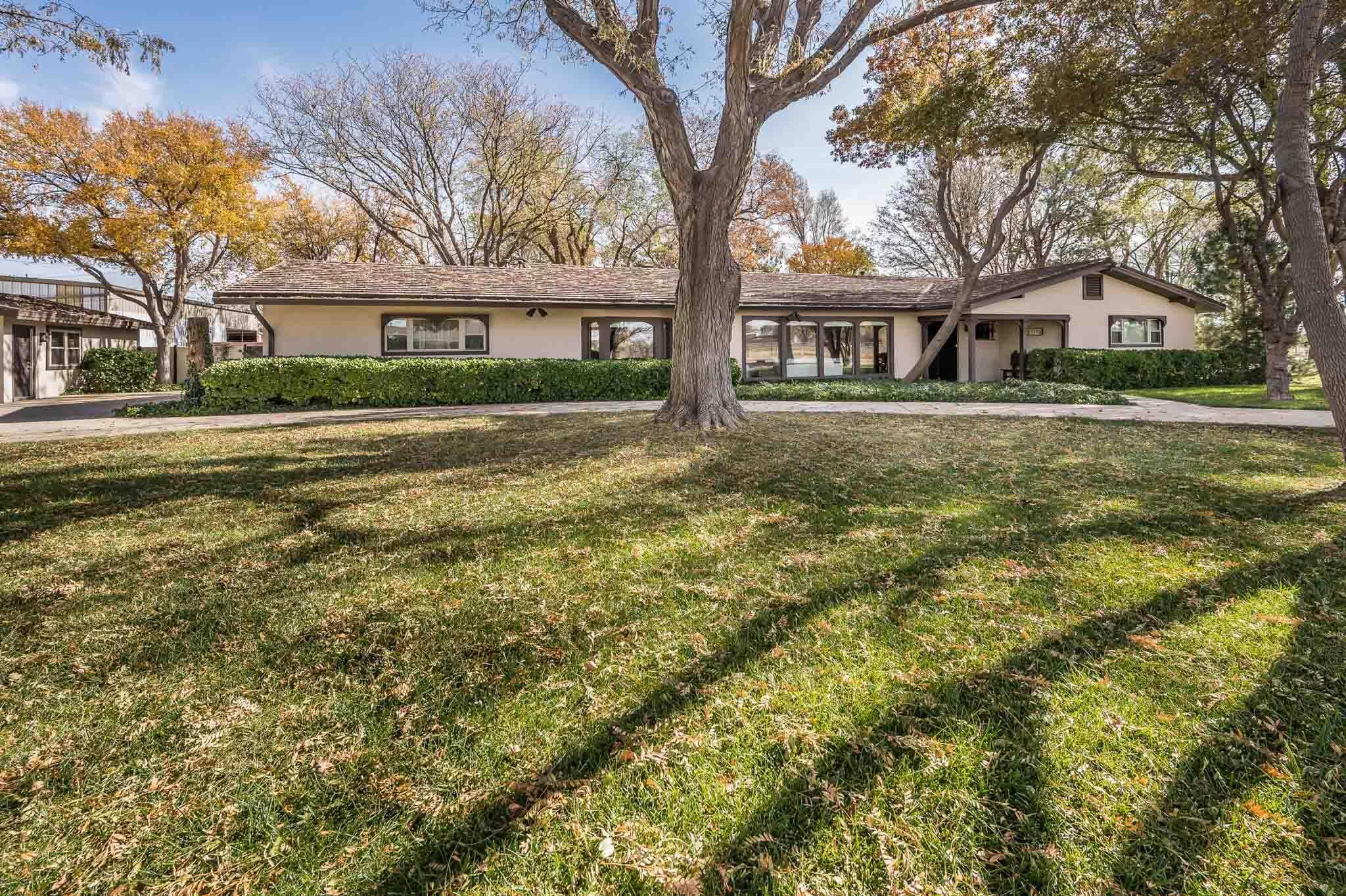 7517 Duling Lane Amarillo, TX 79110 - Photo 2 of 80 a front view of a house with a garden