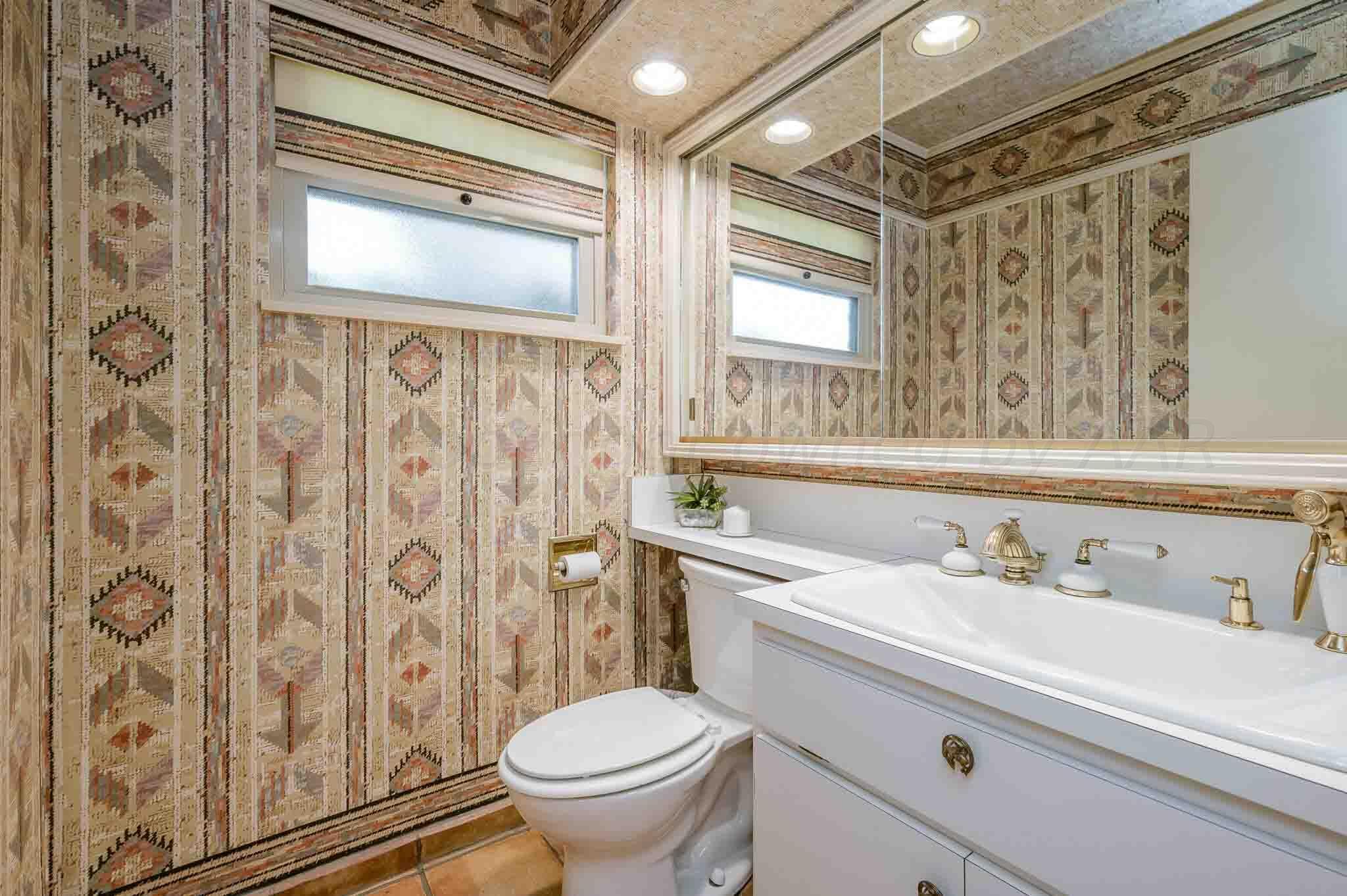 7517 Duling Lane Amarillo, TX 79110 - Photo 21 of 80 a bathroom with a sink a toilet and shower curtain