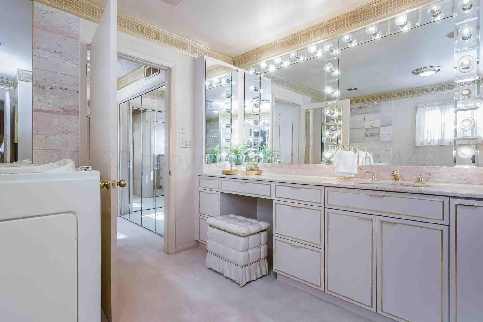 7517 Duling Lane Amarillo, TX 79110 - Photo 25 of 80 a bathroom with a double vanity sink and a mirror