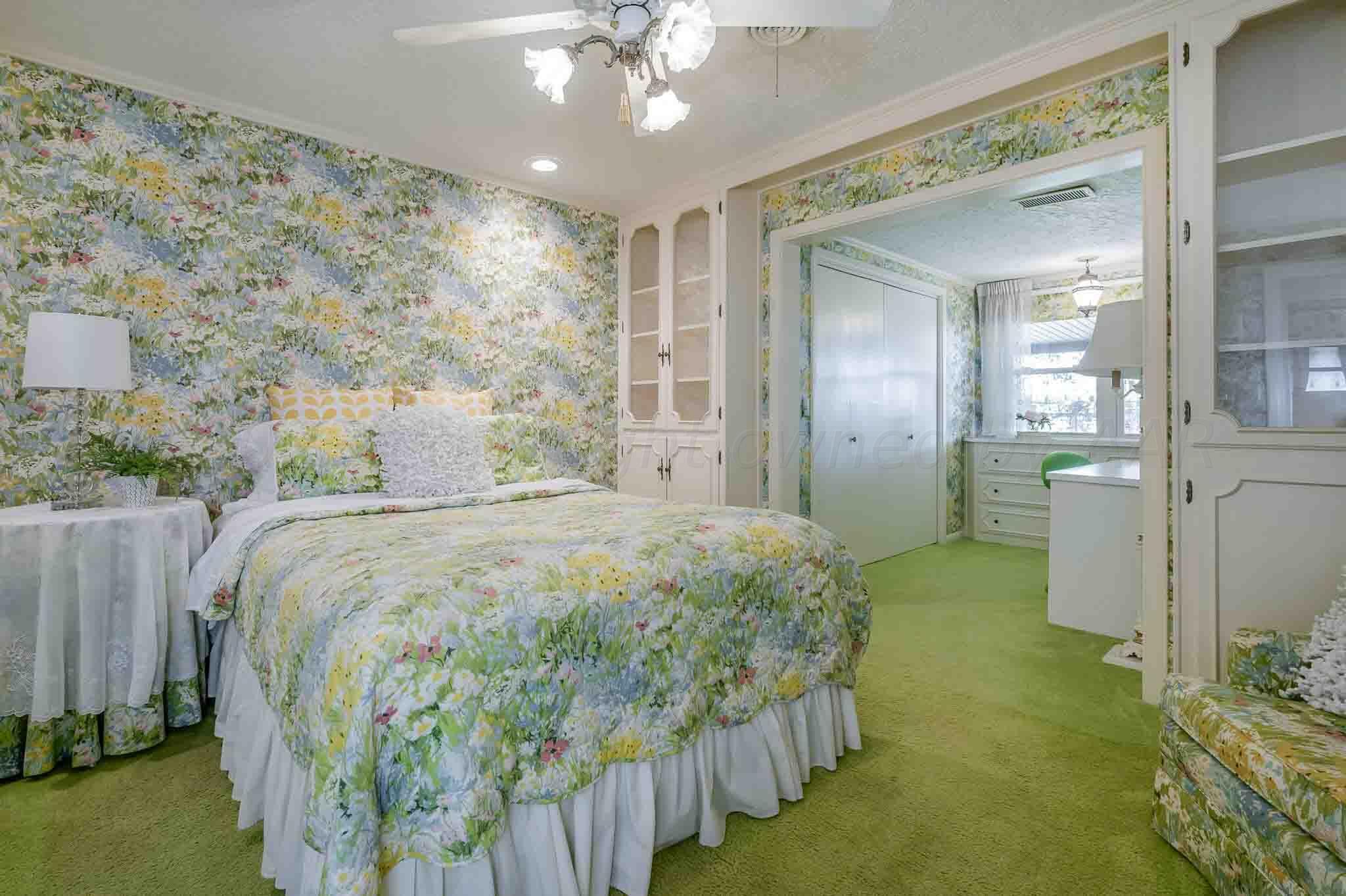 7517 Duling Lane Amarillo, TX 79110 - Photo 30 of 80 a spacious bedroom with a bed and a mirror